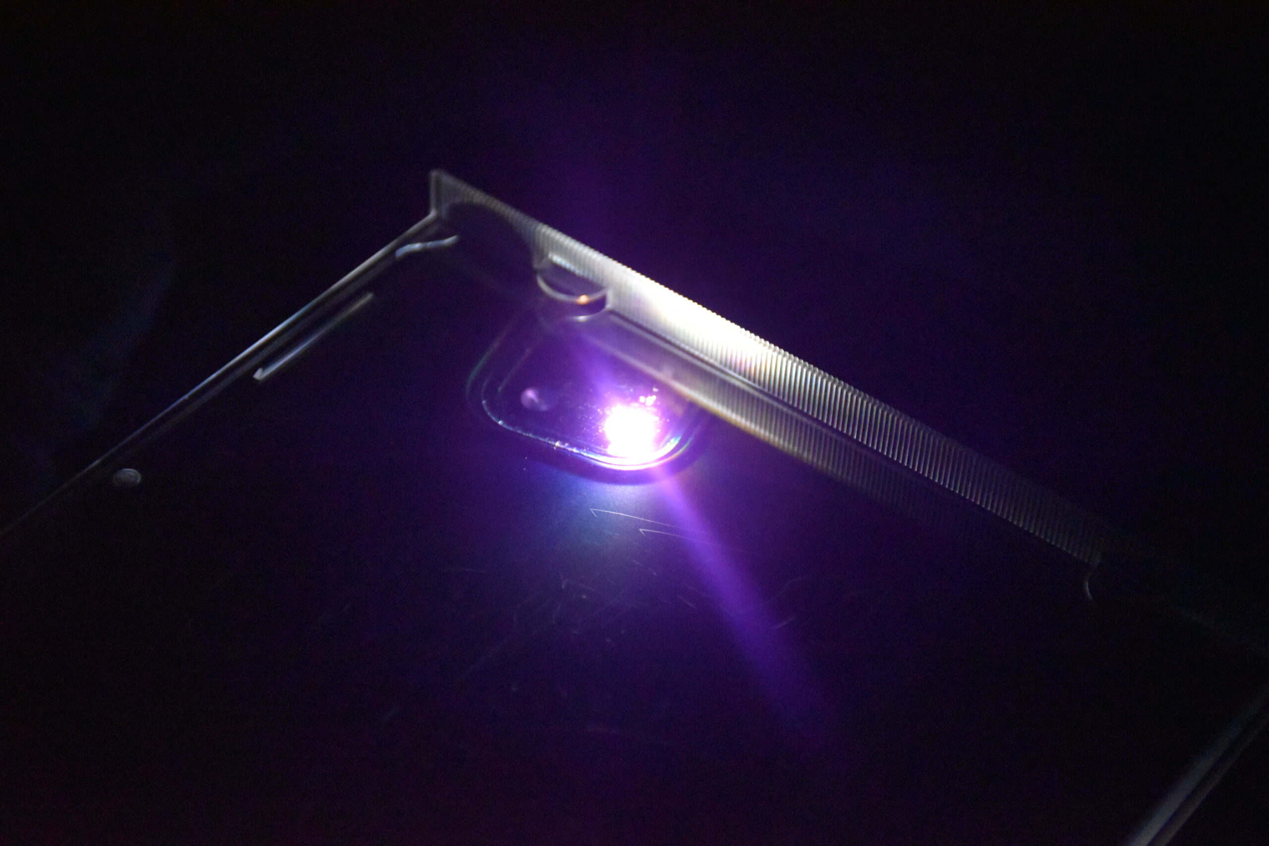 Purple LED Light from my phone under a CD case